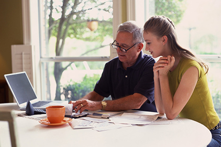 Father and daughter discussing finances